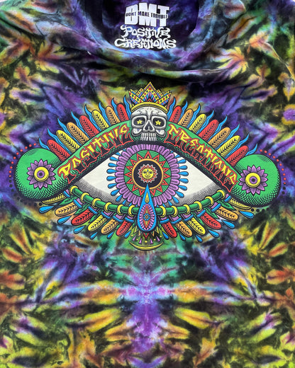 Close-up of Chris Dyer Positive Eye artwork on Cosmic purple, yellow and green handmade tie-dye long-sleeve shirt