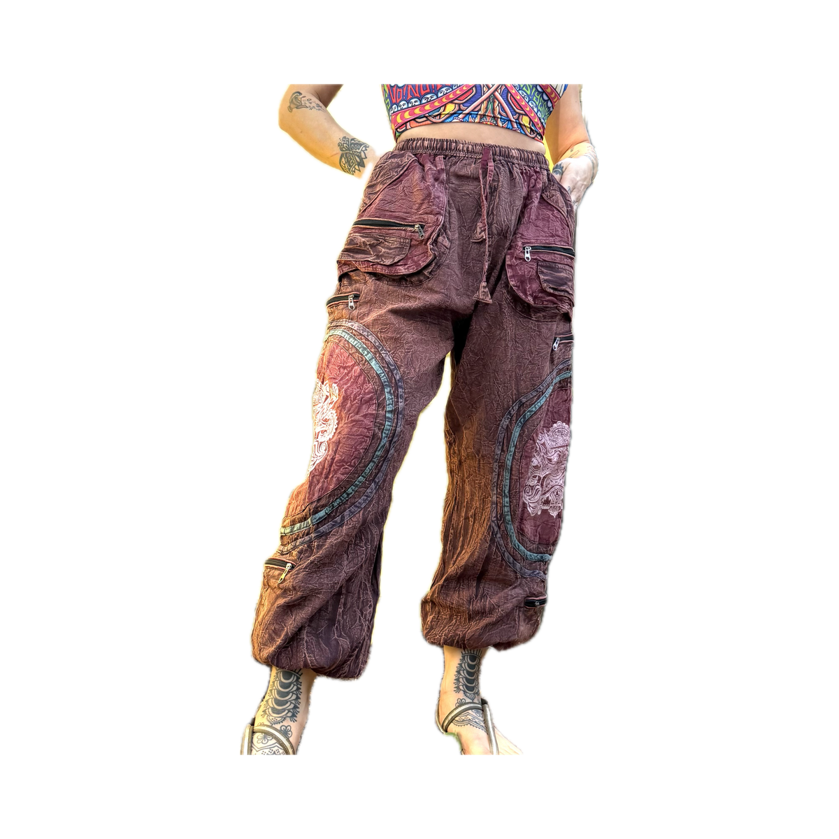 Front view of handmade burgundy Chris Dyer Dyer-Jawnz parachute pants featuring multiple cargo pockets, patchwork details, and a relaxed fit.