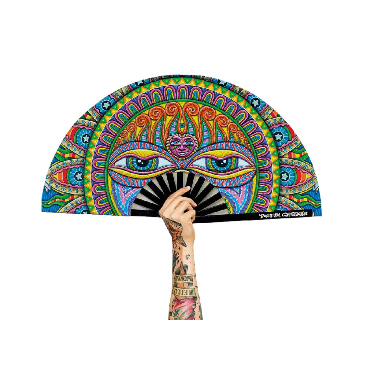 A tattooed hand holds the Festival Folding Fan – Light Worker & Taita Inti, featuring a psychedelic sun face and vivid blue, orange, green, and pink patterns in a vibrant composition.