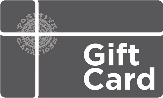 Gray Positive Creations Gift Card with white intersecting lines on the left, a detailed circular logo in the center, and Gift Card in bold white text on the right.