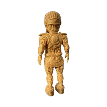 The Galaktic Dude Figurine, an 8-inch art toy in a vibrant yellow armored suit with intricate molded details, stands upright facing away