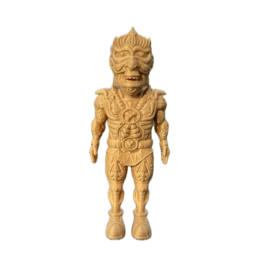 The Galaktic Dude Figurine, a golden warrior figurine with a tribal mask head standing upright.