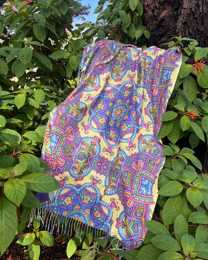     Detail of Chris Dyer Expanding Lightworker reversible pashmina with vibrant psychedelic artwork and tasseled edges